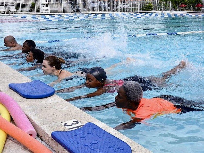 An adult swimmer training confidently in the pool