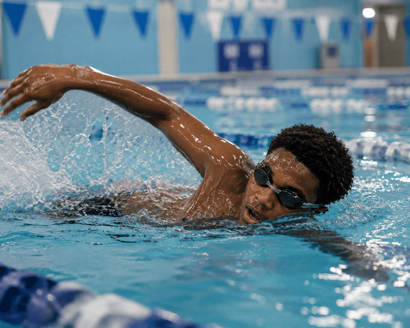 A teenager confidently swimming in structured aquatic training